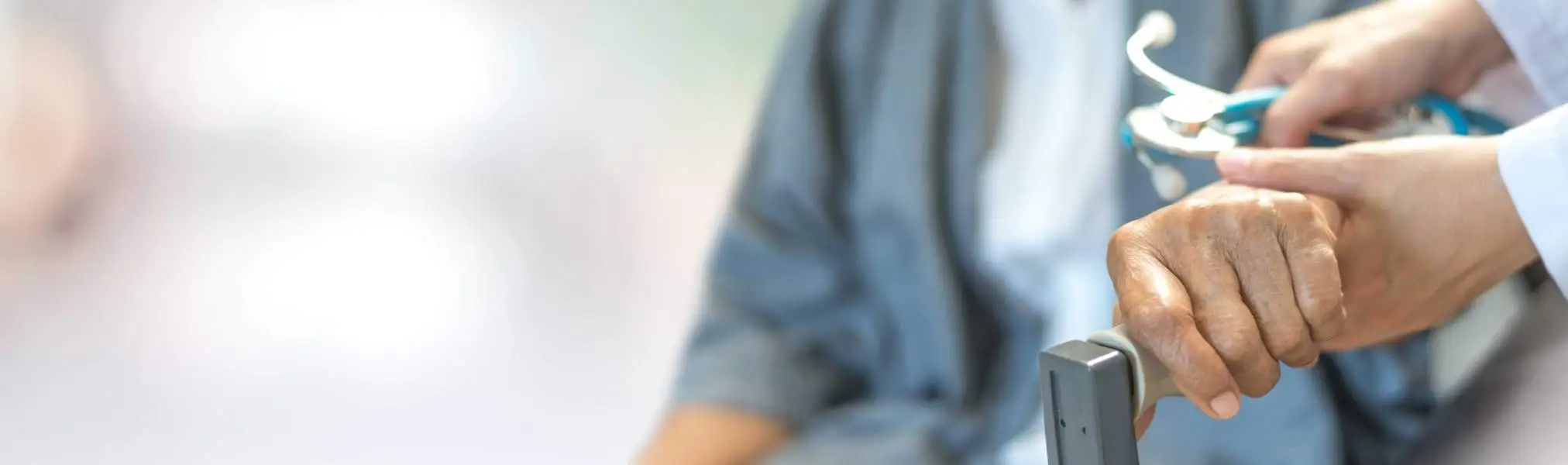 A physician listening to a patient during an office visit